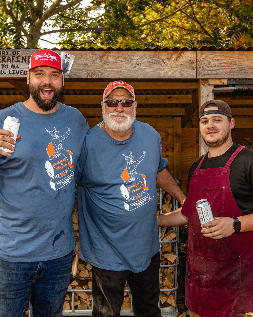 Hindsight BBQ crew by the woodpile