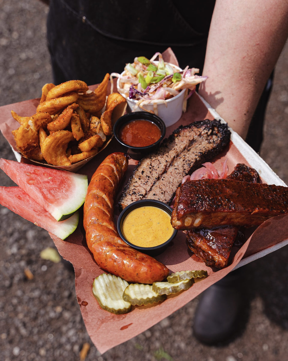 Hindsight BBQ platter with sausage, brisket and ribs