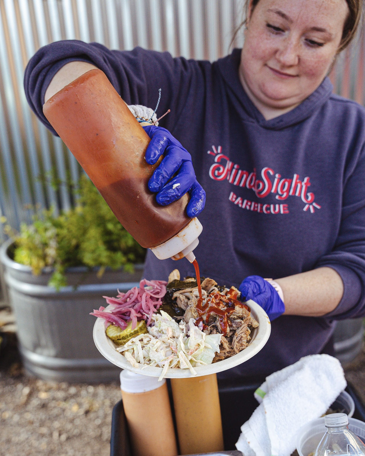 Saucing a plate of barbecue